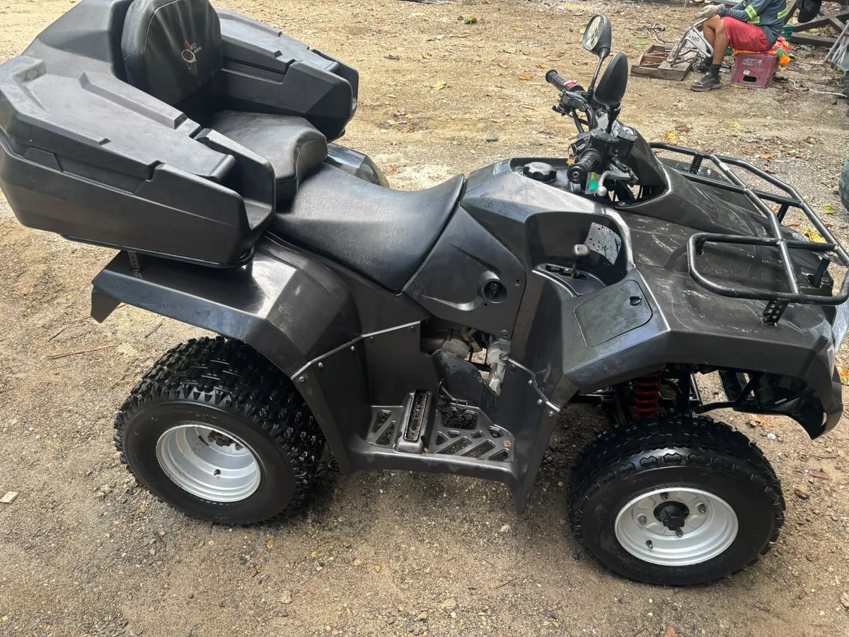Honda 4x4 ATV with locking rear cargo box and passenger backrest
