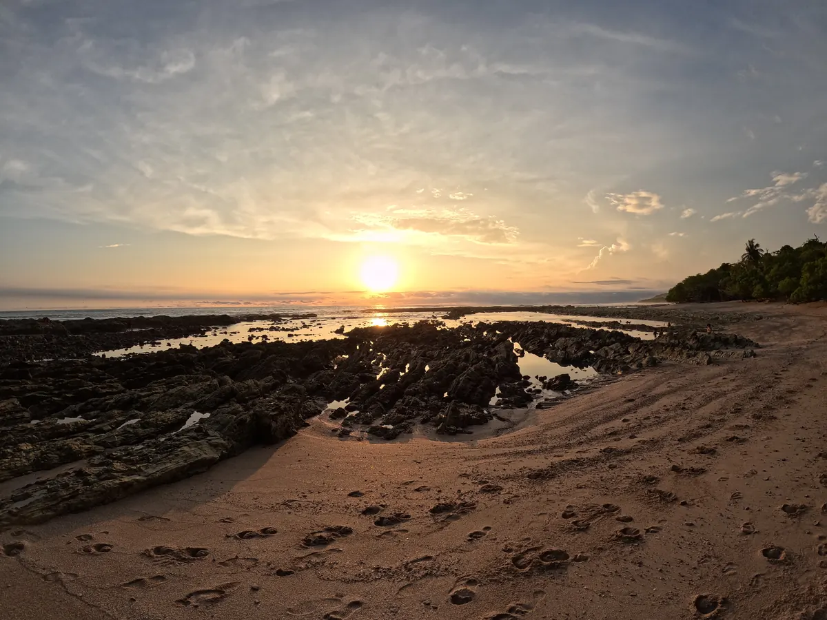 Low-tide rock pools at sunset on the coast south of Santa Teresa toward Mal País
