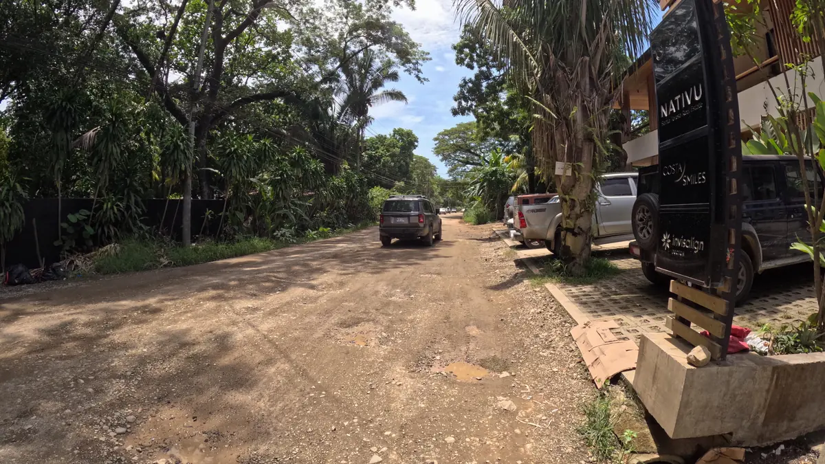 A potholed dirt side road off the main street in Santa Teresa, the kind of surface a 4x4 quad is built for
